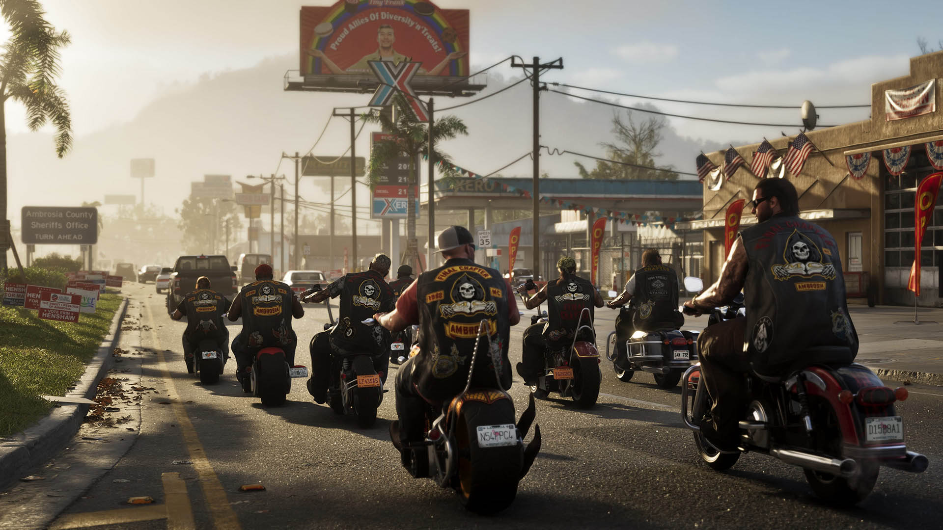 A gang of bikers wearing matching “Ambrosia” patches rides through a small, sunlit town lined with gas stations, campaign signs, and American flags—capturing the gritty, rebellious atmosphere of Ambrosia County in GTA 6.