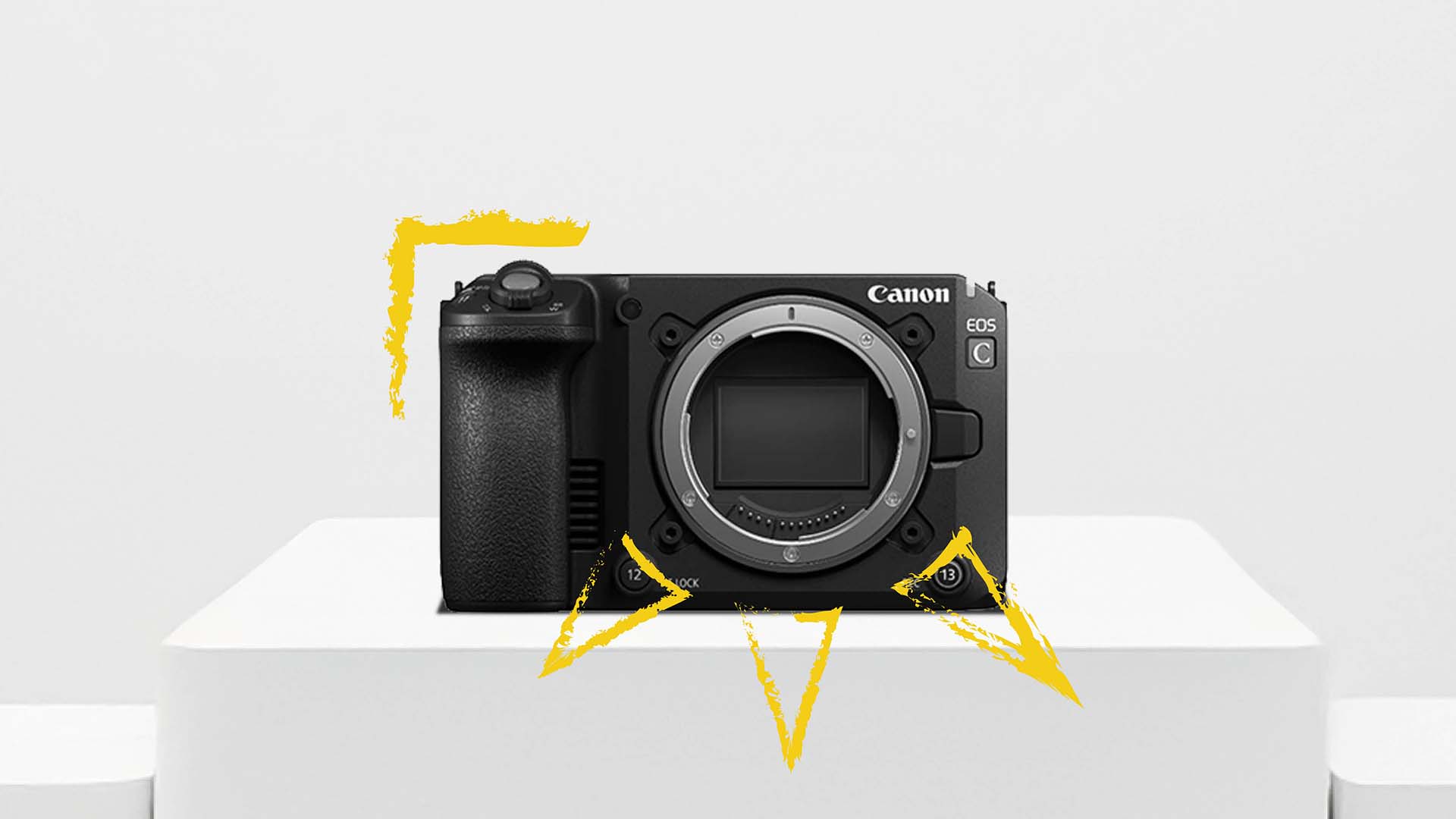 Front view of the Canon EOS C50 cinema camera body without lens, displayed on a white pedestal with yellow graphic accents.