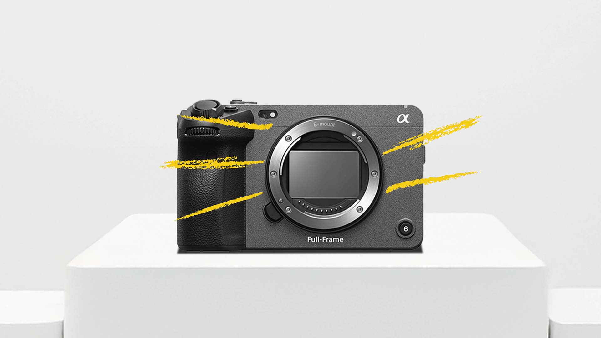 Front view of the Sony FX3 full-frame cinema camera body without lens, displayed on a white pedestal with yellow graphic accents.