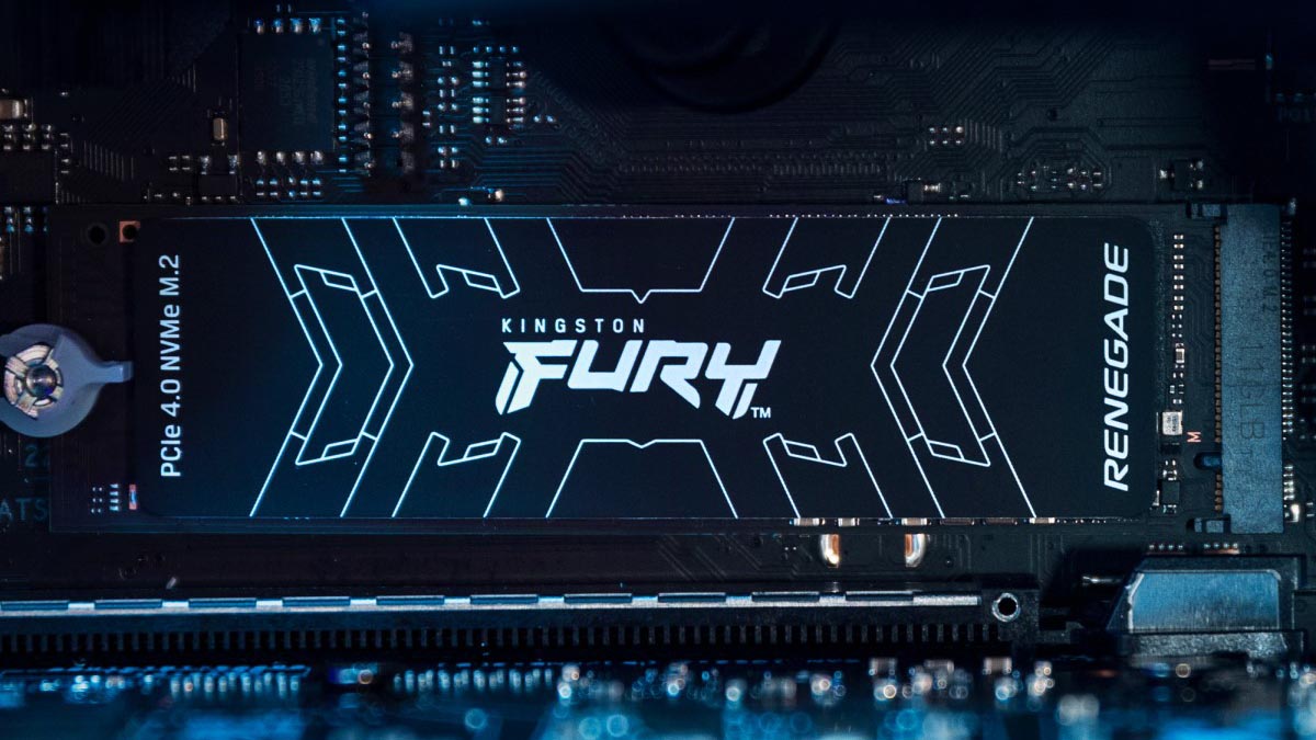 Close-up of a Kingston FURY Renegade PCIe 4.0 NVMe M.2 SSD installed on a motherboard, showcasing its sleek black design with white branding and circuit details.