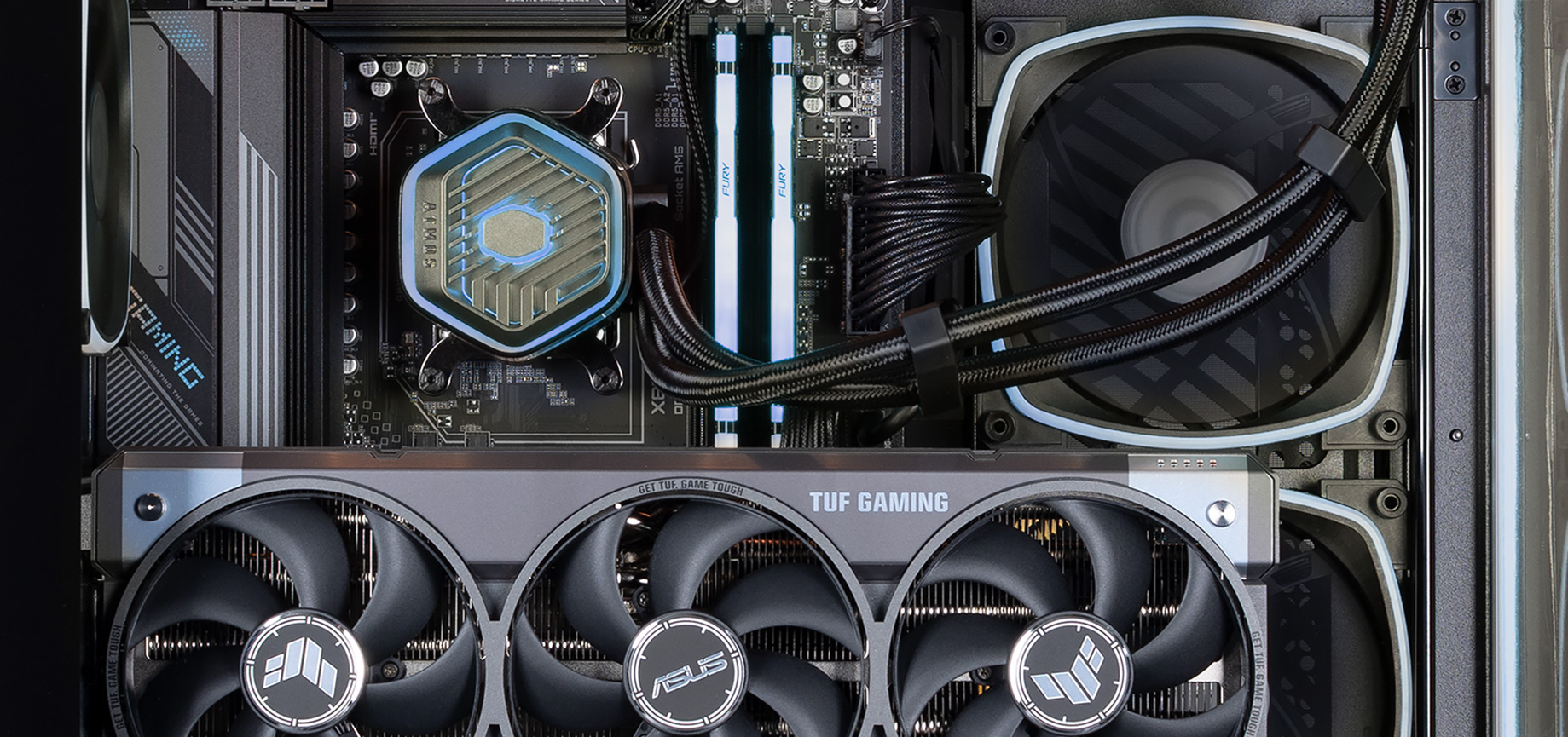 A view from the side of the CPU, RAM and graphics card in the Forge 5080, glowing blue from the RGB