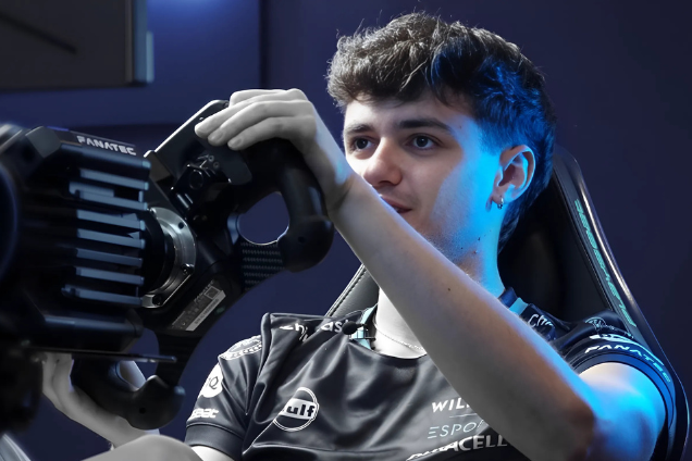 Alvaro Carreton Williams Esports driver taking part in a tournament looking to the left of the image with a racing wheel in his hands.