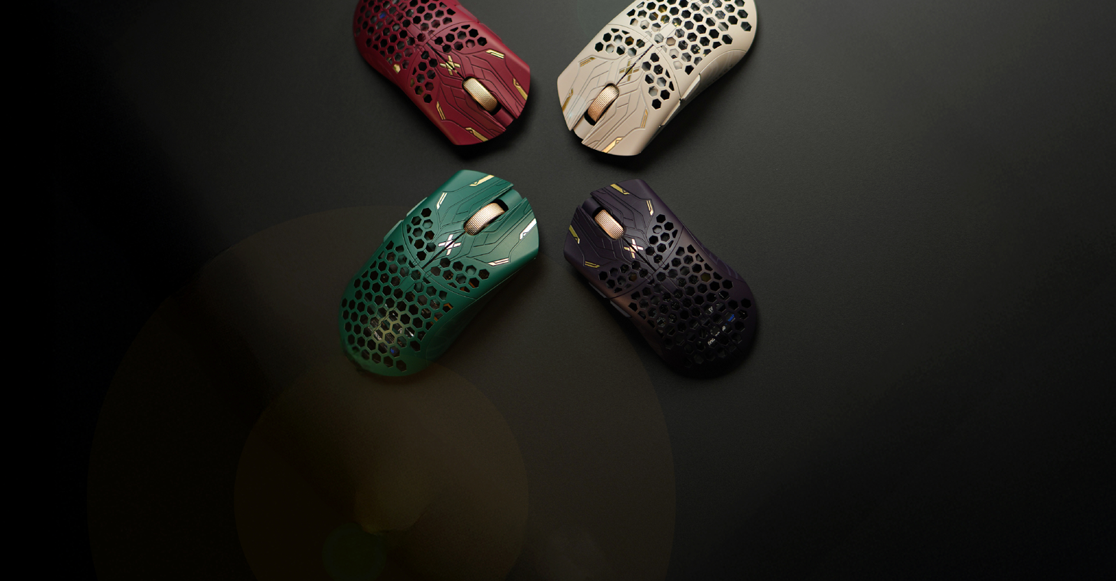 Four coloured Finalmouse gaming mice in red white green and deep purple