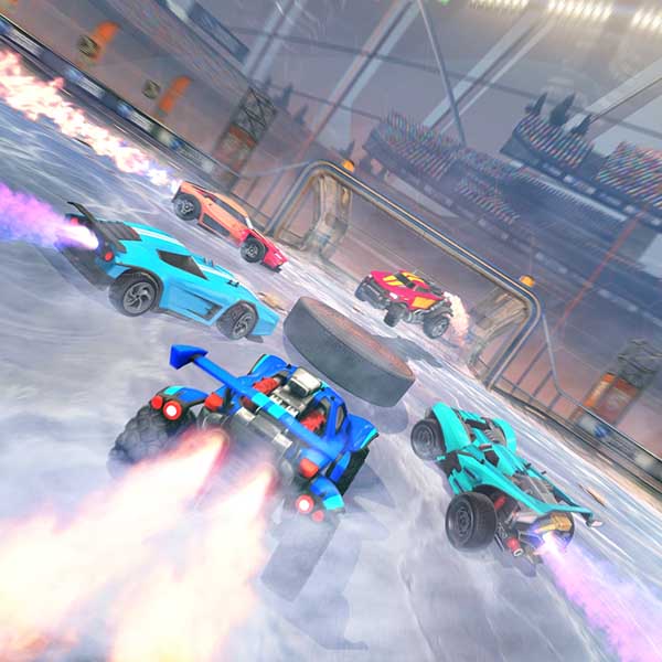 Rocket League gameplay on an icy arena showing multiple rocket-powered cars chasing a giant hockey puck toward the goal in a winter-themed mode.