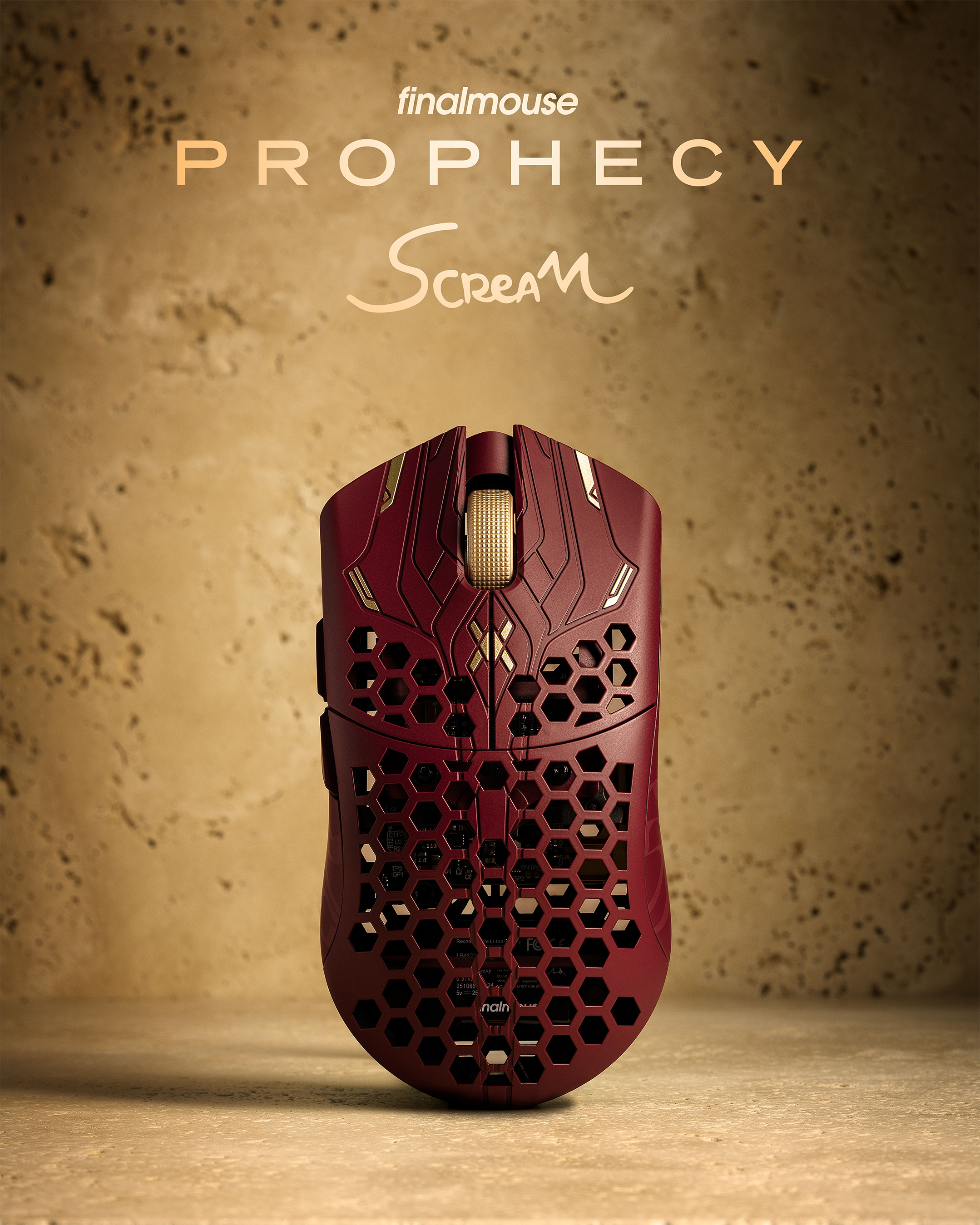 A red UltralightX Prophecy mouse against a sandstone background